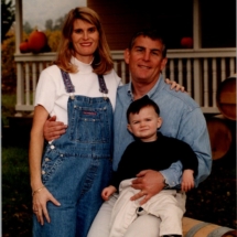 steve and suzie smiling with cameron