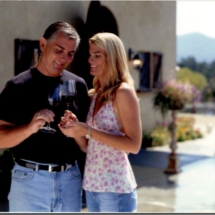 Steve and suzie reynolds cheers with wine