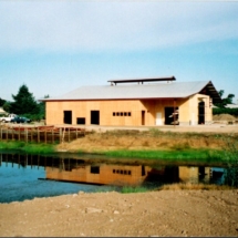 contruction of the winery with view of the pond