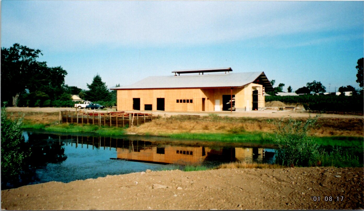 contruction of the winery with view of the pond
