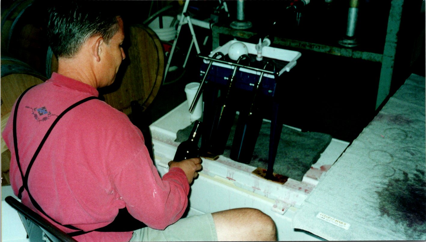 stvee reynolds hand bottling wine